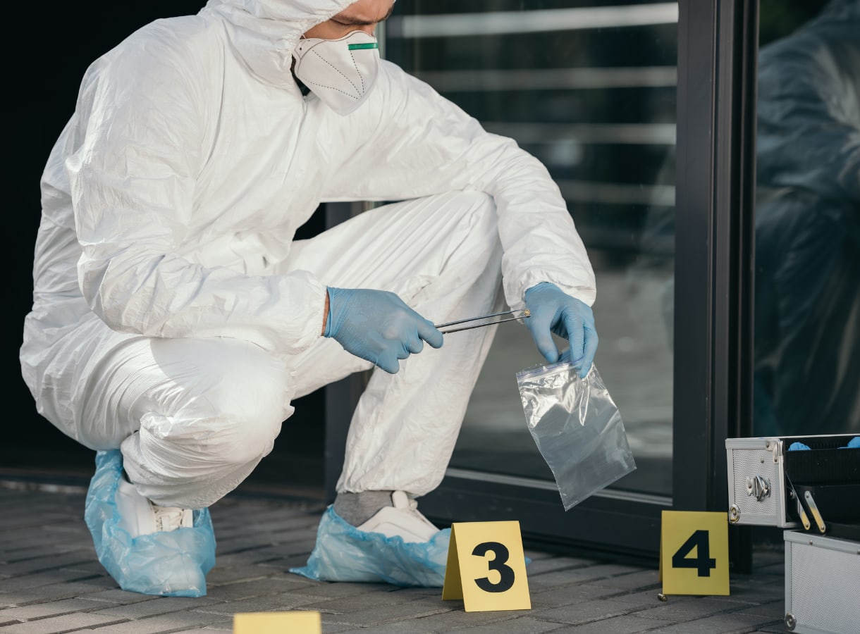 Criminologist collecting evidence